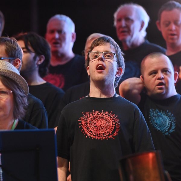 Photo of Dougie Jacobssen singing with Tutti Choir