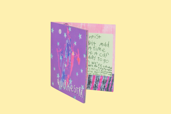 The Outta This Quirky World booklet partially open by Quirkestra.