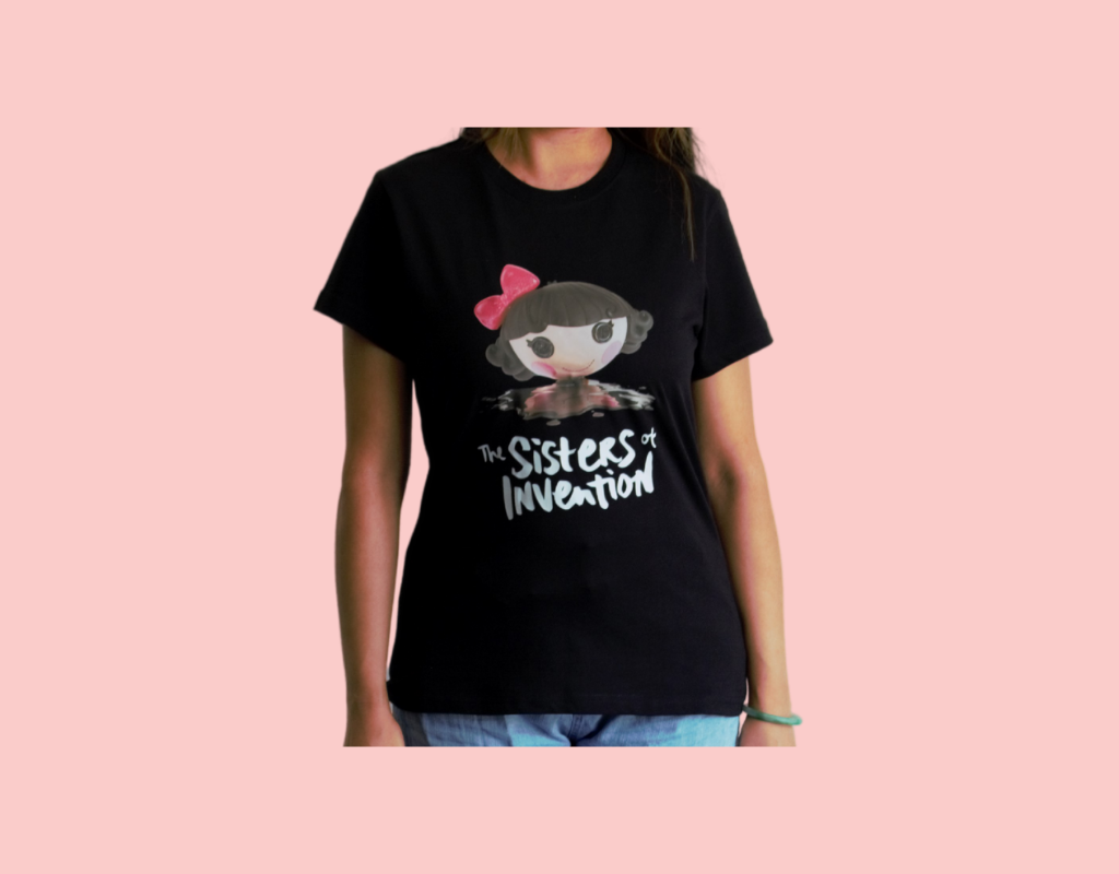 Black t-shirt with The Sisters of Invention logo featuring a doll's head in black paint.
