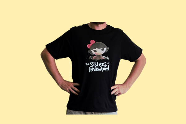 Person wearing black t-shirt with The Sisters of Invention logo featuring a doll's head in black paint.