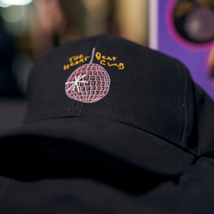 black cap with Heart Beat Club logo