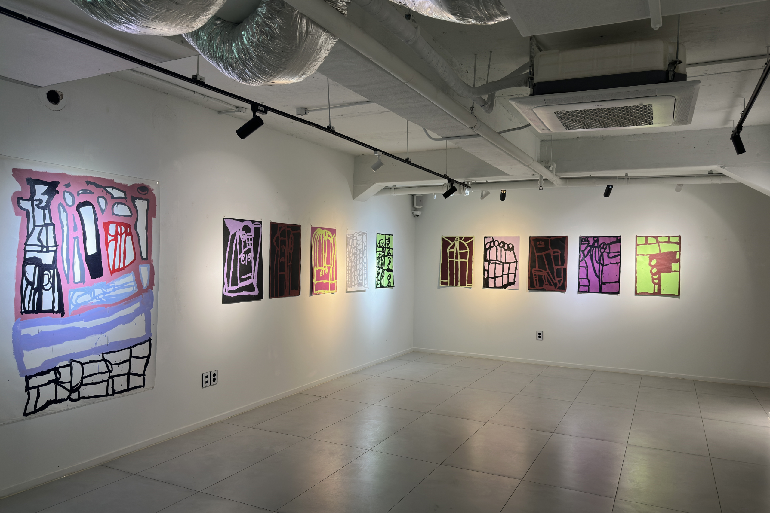 Lewis' work at the Korean exhibition opening in his signature bold and duo-tone style.