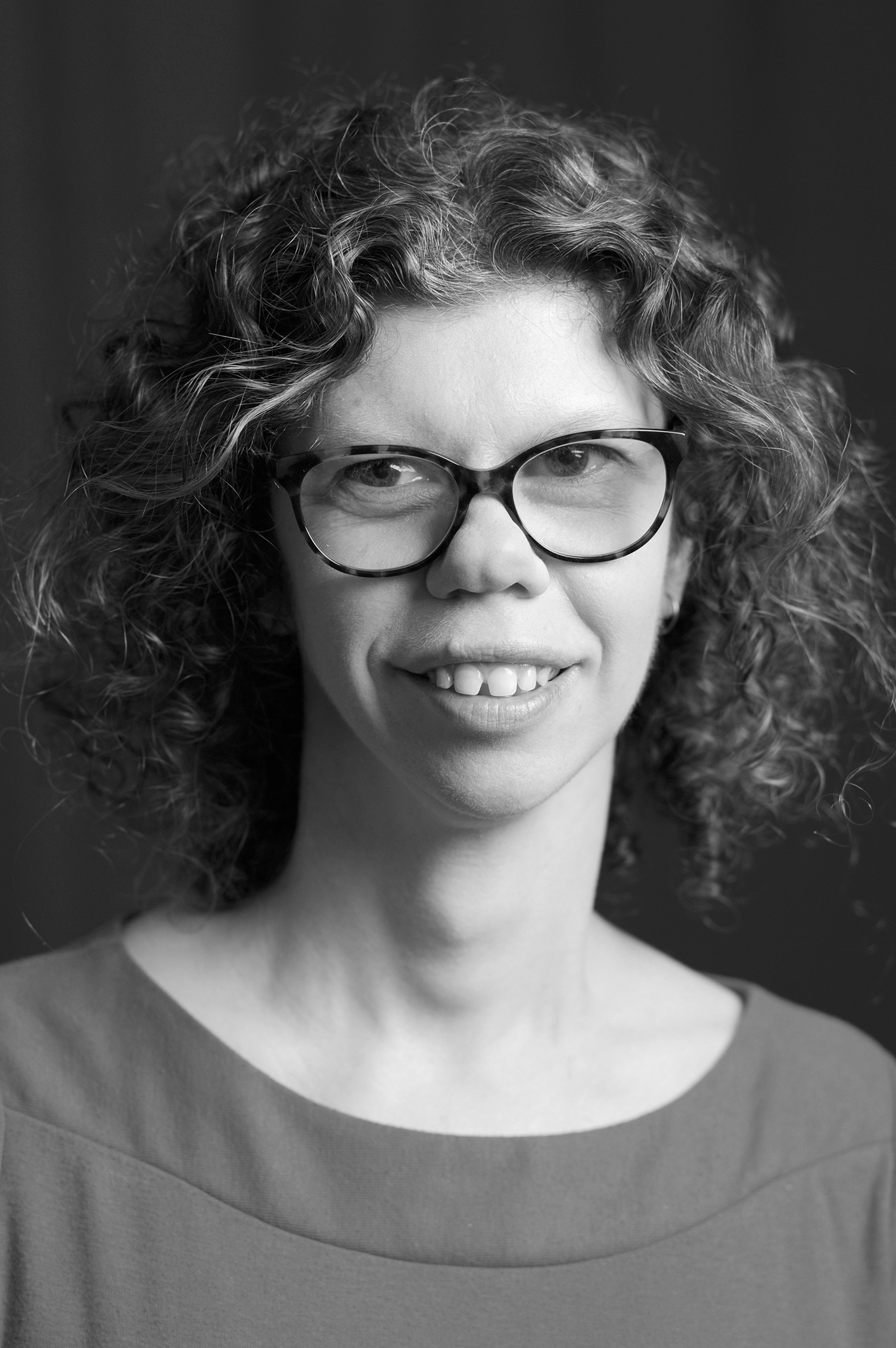 Black and white headshot of Aimee Cathern. 