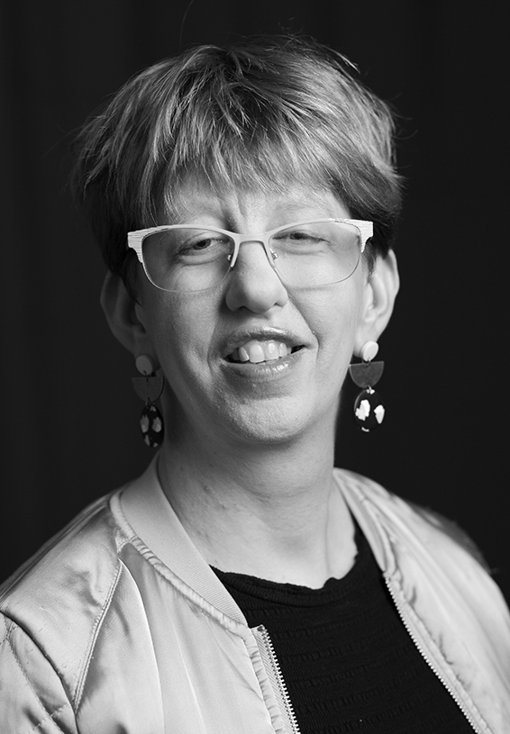 Black and white headshot of Caroline. 