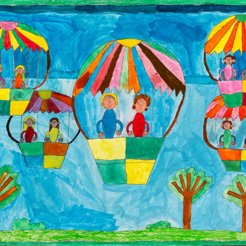 Five hot air balloons carrying two passengers each created in watercolour. They are all floating in a group above a green landscape with some trees and against a blue sky. The balloons have a colourful checked pattern on them and each person is wearing a different coloured shirt and smiling. There is a sold green frame around the painting.