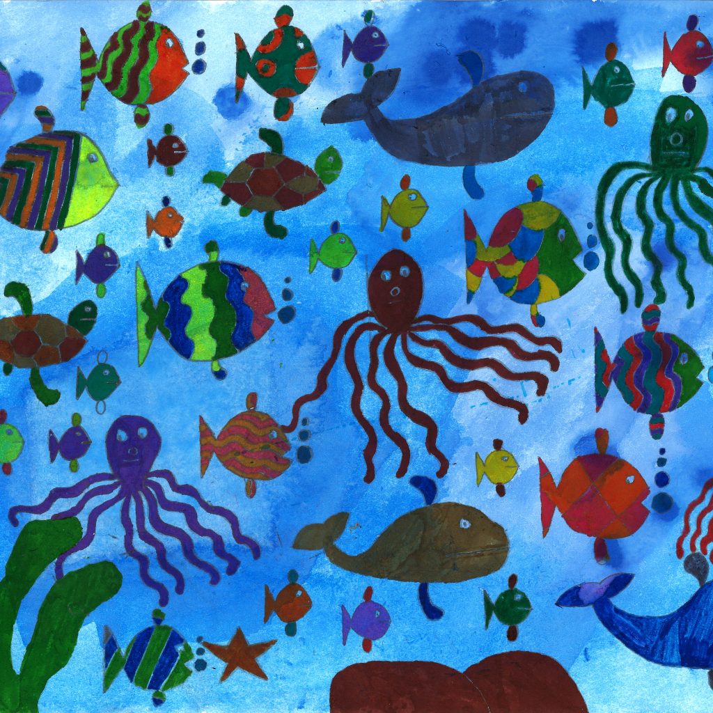 An underwater scene featuring lots of different fish with different patterns of scales, there are also whales, starfish, octopi and turtles all swimming above a reef.