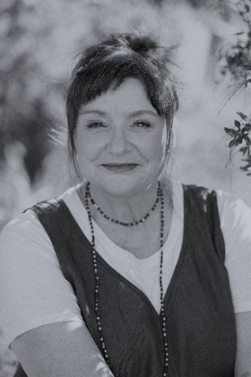 Black and white headshot of Carol.