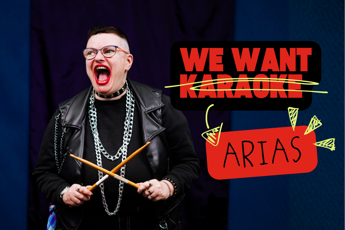 Excited disabled artist wearing leather jacket hold drumsticks, with the text 'we want karaoke [karaoke scored out] Arias