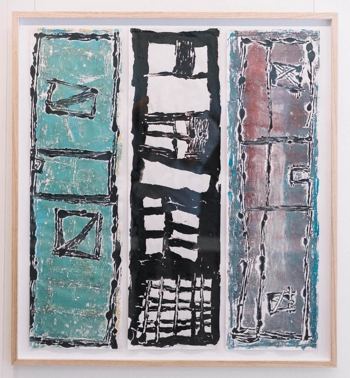 A triptych showing Lewis' works created by ink prints on glass. 